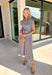 Rich autumn hues and timeless details make this striped midi dress an easy favorite for the season ahead. Featuring light blue and brown stripes, this dress captures everything we love about fall. The flattering v-neckline is finished with a sweet self-tie detail, while the gathered waist creates a feminine silhouette that's both comfortable and flattering. Cap sleeves, side pockets, and a fully lined design make it as practical as it is stylish. 