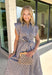 Rich autumn hues and timeless details make this striped midi dress an easy favorite for the season ahead. Featuring light blue and brown stripes, this dress captures everything we love about fall. The flattering v-neckline is finished with a sweet self-tie detail, while the gathered waist creates a feminine silhouette that's both comfortable and flattering. Cap sleeves, side pockets, and a fully lined design make it as practical as it is stylish. 