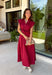 Rich autumn hues and timeless details make this striped midi dress an easy favorite for the season ahead. Featuring warm red and brown stripes, this dress captures everything we love about fall. The flattering v-neckline is finished with a sweet self-tie detail, while the gathered waist creates a feminine silhouette that's both comfortable and flattering. Cap sleeves, side pockets, and a fully lined design make it as practical as it is stylish. 