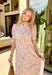 Say hello to your new go-to spring dress! This off white botanical midi dress by Entro is sprinkled with the prettiest floral pops of pink, yellow, and green for the ultimate fresh-picked feel. The ruffled band collar and v-neckline add a sweet, feminine touch, while the button-front design and side pockets keep it practical (because cute AND functional is the goal). Fully lined and easy to wear from brunch to special occasions to weekend plans!