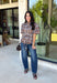Classic plaid gets a fresh fall update with this brown and blue blouse from Entro. The mix of warm brown and cool blue creates an eye-catching color combination that fits right into your autumn wardrobe. A shirt collar and button-front closure give it a classic feel, while pleated detailing at the front and back adds shape and texture. The self-tie belt lets you define the waist, and the peplum hem creates a flattering finish that's perfect with denim or trousers. 