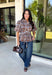 Classic plaid gets a fresh fall update with this brown and blue blouse from Entro. The mix of warm brown and cool blue creates an eye-catching color combination that fits right into your autumn wardrobe. A shirt collar and button-front closure give it a classic feel, while pleated detailing at the front and back adds shape and texture. The self-tie belt lets you define the waist, and the peplum hem creates a flattering finish that's perfect with denim or trousers. 