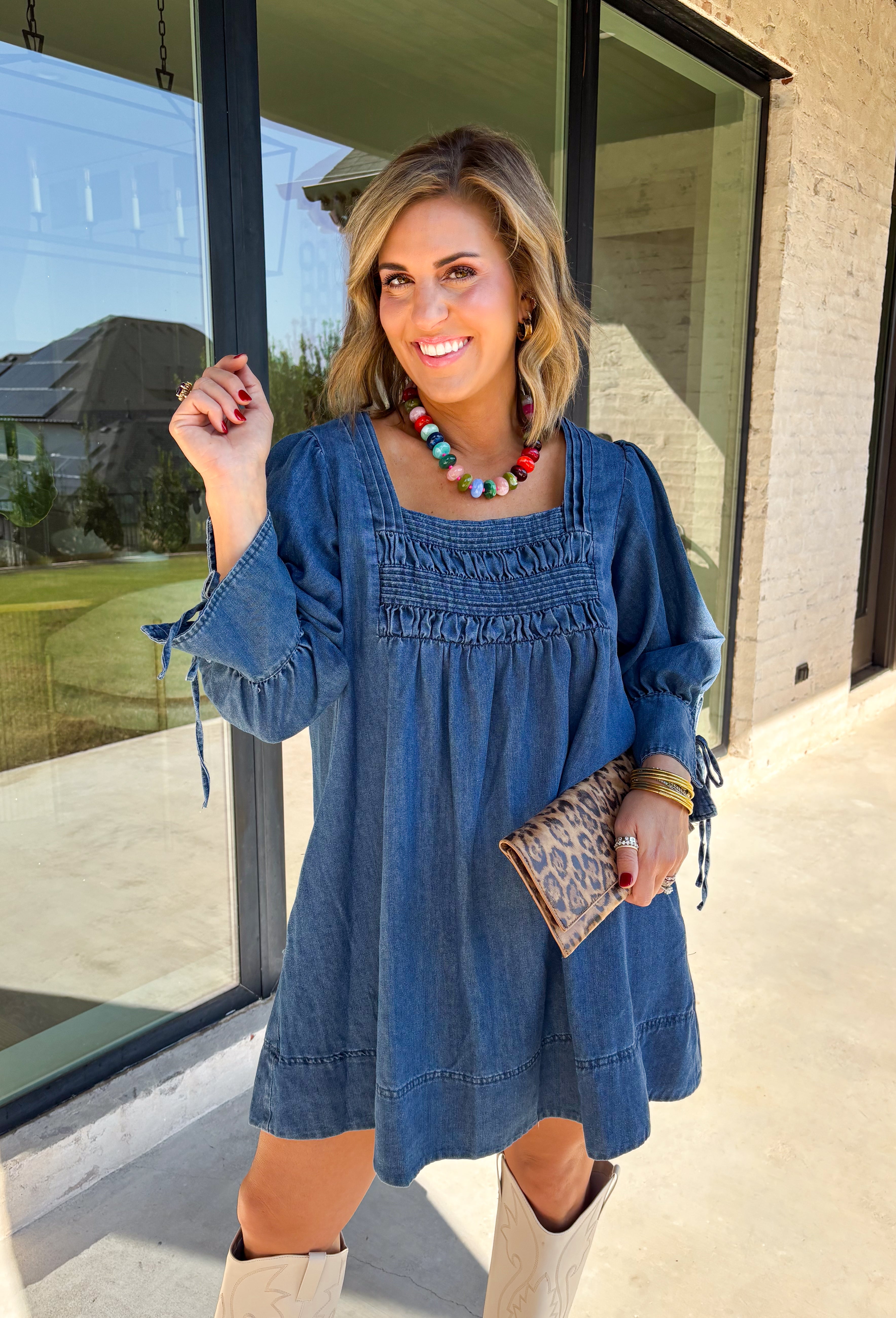 A timeless denim dress is always in style, and this one is made for all your favorite fall moments! Crafted from soft dark wash denim, this effortlessly feminine dress features a flattering smocked yoke that adds beautiful texture and a comfortable fit. The square neckline gives it a modern, polished look, while the tie details on the sleeves add the sweetest finishing touch. 