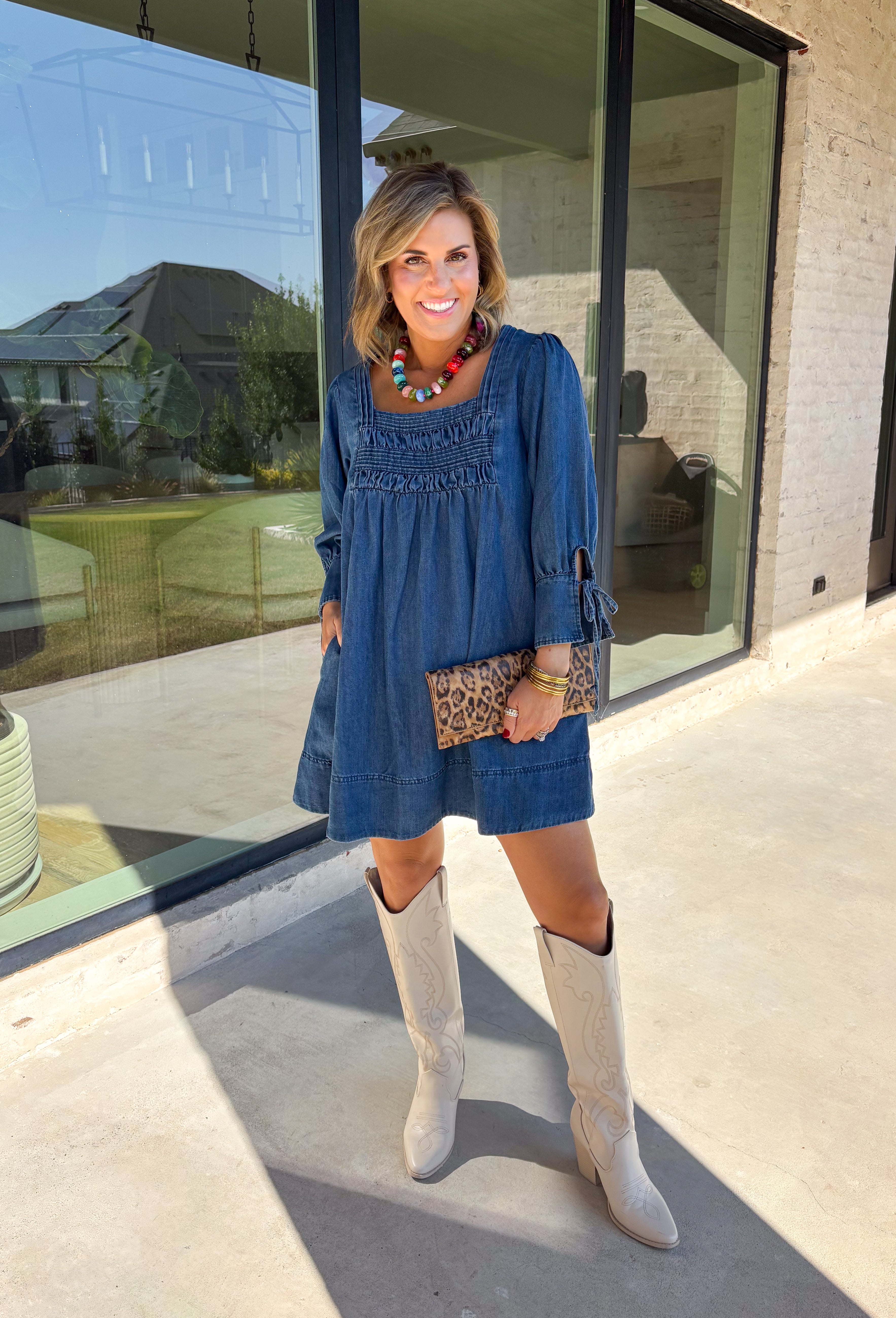 A timeless denim dress is always in style, and this one is made for all your favorite fall moments! Crafted from soft dark wash denim, this effortlessly feminine dress features a flattering smocked yoke that adds beautiful texture and a comfortable fit. The square neckline gives it a modern, polished look, while the tie details on the sleeves add the sweetest finishing touch. 