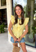 This pastel yellow top is pure sunshine in your summer wardrobe! The soft color feels fresh and cheerful, while the elastic waist creates a flattering, easy shape that’s comfortable for all-day wear. The ruffle sleeves add a feminine touch, and the v-neckline keeps it light and breezy for warm days. Made from breathable cotton, it’s perfect for everything from casual outings to lunch with friends. Pair it with white denim or shorts for an effortlessly bright look—this one is an instant mood booster.