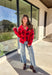 Make a bold statement while staying cozy in this red fuzzy button-down cardigan by See and Be Seen. Featuring a playful black leopard print, this cardigan adds a fun twist to chilly-day layering. The ultra-soft texture feels as good as it looks, making it a go-to for everything from lounging at home to dressing up your favorite denim.