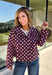 Give your fall layers a playful update with this wine-colored polka dot jacket from Entro. The rich wine shade is covered in classic white polka dots, creating a fun statement print that still pairs easily with your favorite seasonal neutrals. A collared neckline and button-down front give it a classic jacket feel, while tie details at the front and sides of the hem add a unique finishing touch. 