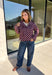 Give your fall layers a playful update with this wine-colored polka dot jacket from Entro. The rich wine shade is covered in classic white polka dots, creating a fun statement print that still pairs easily with your favorite seasonal neutrals. A collared neckline and button-down front give it a classic jacket feel, while tie details at the front and sides of the hem add a unique finishing touch. 
