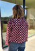 Give your fall layers a playful update with this wine-colored polka dot jacket from Entro. The rich wine shade is covered in classic white polka dots, creating a fun statement print that still pairs easily with your favorite seasonal neutrals. A collared neckline and button-down front give it a classic jacket feel, while tie details at the front and sides of the hem add a unique finishing touch. 