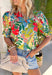 Bright, cheerful, and ready for all your spring plans, this off-white floral top by Entro is the kind of piece that instantly lifts your whole outfit. The colorful print features pops of green, red, pink, and blue for the prettiest burst of seasonal color, while the ruffled mock neck and v-neckline add a flattering, feminine touch. Finished with puff sleeves and elasticated cuffs, it’s easy to wear, easy to love, and perfect for everything from brunch to the office.