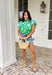 Soft, fresh, and full of spring charm! This light blue short sleeve top features a beautiful green floral print layered over textured floral eyelet lace for the prettiest dimension. It’s feminine without feeling fussy — just the right balance of sweet and polished. Designed with a classic button down front, this top is finished with a ruffle neckline and ruffle sleeves that add movement and a soft romantic touch. Crafted from breathable 100% cotton.