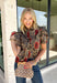 Bring warm autumn colors to your everyday wardrobe with this effortlessly feminine floral blouse. Designed with a beautiful camel backdrop and a vibrant floral print in shades of red, black, olive, and navy, this timeless top is perfect for everything from workdays to weekend outings. Delicate pleating along the front adds beautiful texture, while the button-front design and elastic cuff sleeves create a polished yet comfortable look. 