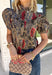 Bring warm autumn colors to your everyday wardrobe with this effortlessly feminine floral blouse. Designed with a beautiful camel backdrop and a vibrant floral print in shades of red, black, olive, and navy, this timeless top is perfect for everything from workdays to weekend outings. Delicate pleating along the front adds beautiful texture, while the button-front design and elastic cuff sleeves create a polished yet comfortable look. 
