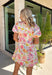 This floral puff sleeve dress is the kind of piece that makes summer styling feel so easy! Designed with a soft neutral base and pops of pink, green, orange, and periwinkle, it brings just the right amount of color while still feeling wearable for everyday plans. The flattering v-neckline and button front add a classic touch, while the puff sleeves and elastic openings give it that feminine shape everyone loves. And yes—side pockets make it even better.  