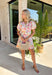 This floral puff sleeve dress is the kind of piece that makes summer styling feel so easy! Designed with a soft neutral base and pops of pink, green, orange, and periwinkle, it brings just the right amount of color while still feeling wearable for everyday plans. The flattering v-neckline and button front add a classic touch, while the puff sleeves and elastic openings give it that feminine shape everyone loves. And yes—side pockets make it even better.  