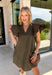 Effortlessly timeless and perfect for the season, this brown mini dress is one you'll reach for all fall long! Crafted from a breathable cotton and linen blend, it features a flattering v-neckline accented with delicate stitching for an elevated touch. The flutter sleeves add soft, feminine movement, while the lined design and side pockets make it as practical as it is beautiful. Finished with a back keyhole button closure.