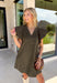 Effortlessly timeless and perfect for the season, this brown mini dress is one you'll reach for all fall long! Crafted from a breathable cotton and linen blend, it features a flattering v-neckline accented with delicate stitching for an elevated touch. The flutter sleeves add soft, feminine movement, while the lined design and side pockets make it as practical as it is beautiful. Finished with a back keyhole button closure.