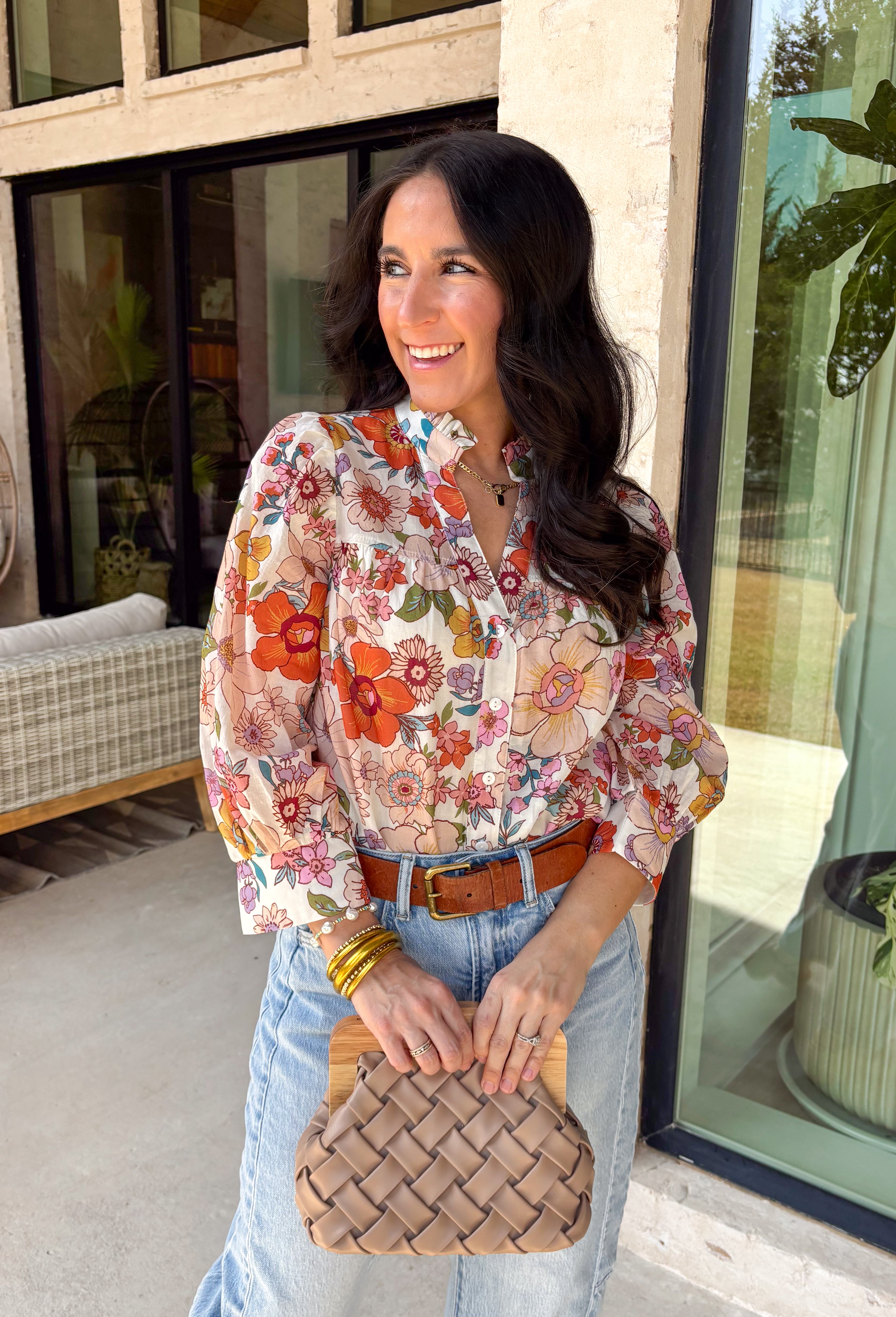 This off-white long sleeve button down top is the definition of effortless spring style. Covered in a beautiful mix of rust, pink, blue, purple, and green florals, it feels fresh, colorful, and ready for sunny days ahead. The classic button-front design and lightweight cotton fabric keep it easy and breathable, while the vibrant print adds that fun pop your wardrobe has been waiting for. It’s polished enough for work and relaxed enough for weekend plans—truly a wear-anywhere favorite.