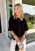 Elevate your everyday fall wardrobe with this effortlessly chic knit top! Crafted from a soft, comfortable knit, this versatile piece is finished with a beautiful scalloped lace hem that adds just the right amount of feminine detail. The classic black color makes it easy to style with everything from denim to printed bottoms, while the trendy silhouette transitions seamlessly from the office to dinner plans. 