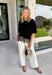 Elevate your everyday fall wardrobe with this effortlessly chic knit top! Crafted from a soft, comfortable knit, this versatile piece is finished with a beautiful scalloped lace hem that adds just the right amount of feminine detail. The classic black color makes it easy to style with everything from denim to printed bottoms, while the trendy silhouette transitions seamlessly from the office to dinner plans. 