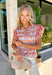 This abstract floral top is bringing all the bold, colorful energy your summer wardrobe needs! With a neutral base and vibrant pops of pink, coral, purple, red, white, and green, it’s the perfect statement piece that still feels easy to style. The contrasting floral print on the sleeves and neckline adds a fun, unexpected twist, while the ruffle sleeves and v-neckline keep it feminine and flattering. Lightweight and breathable, it’s perfect for warm days when you want to stand out without trying too hard. 