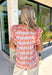 This abstract floral top is bringing all the bold, colorful energy your summer wardrobe needs! With a neutral base and vibrant pops of pink, coral, purple, red, white, and green, it’s the perfect statement piece that still feels easy to style. The contrasting floral print on the sleeves and neckline adds a fun, unexpected twist, while the ruffle sleeves and v-neckline keep it feminine and flattering. Lightweight and breathable, it’s perfect for warm days when you want to stand out without trying too hard. 