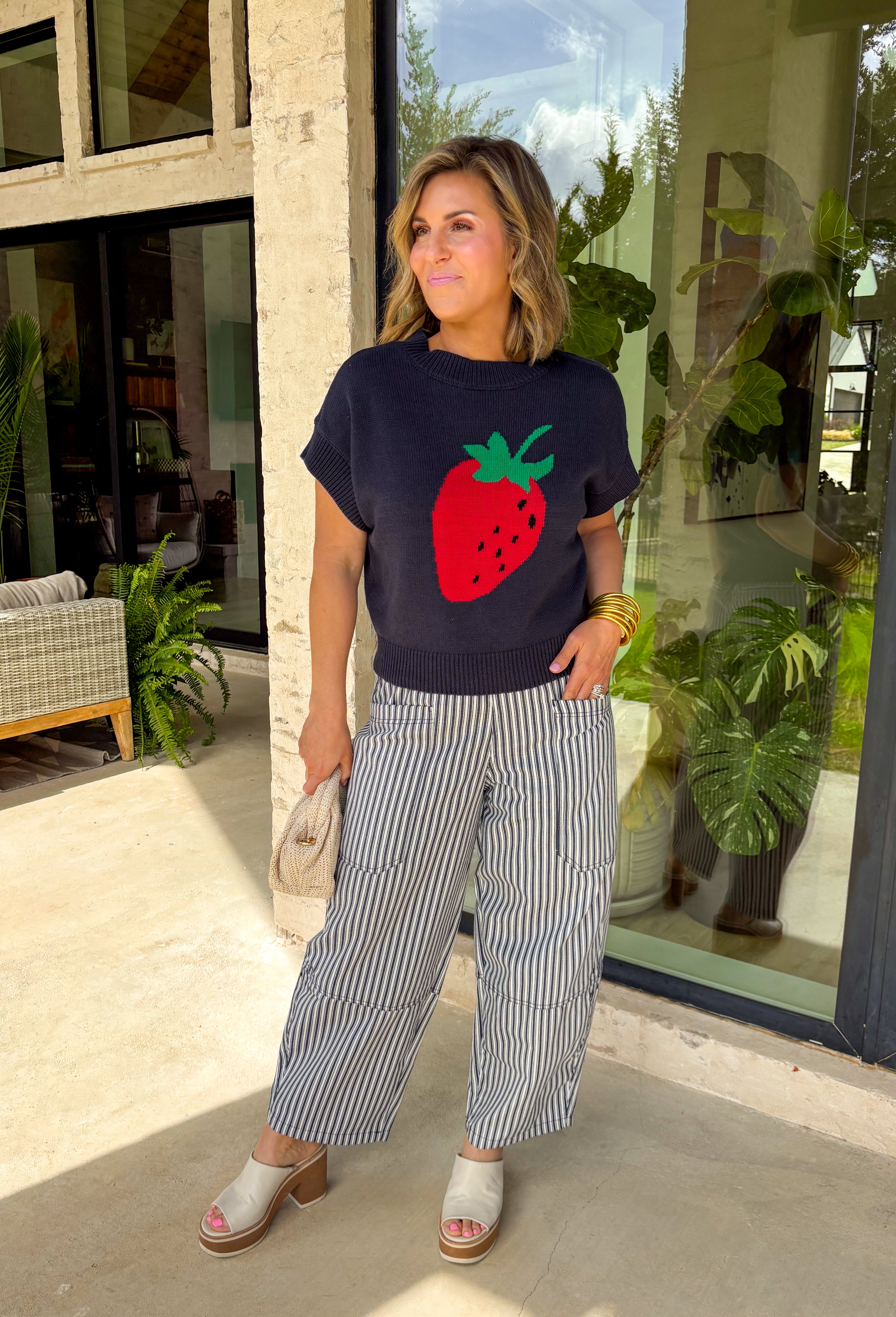 Sweet, playful, and full of charm! This navy short sleeve sweater features the cutest strawberry knit design that instantly adds a fun, fresh touch to your look. The rich navy background makes the strawberries pop, giving it that perfect mix of classic and playful style. Designed with a ribbed neckline, sleeves, and hem, this sweater offers a comfortable and flattering fit that’s easy to wear all day long. 