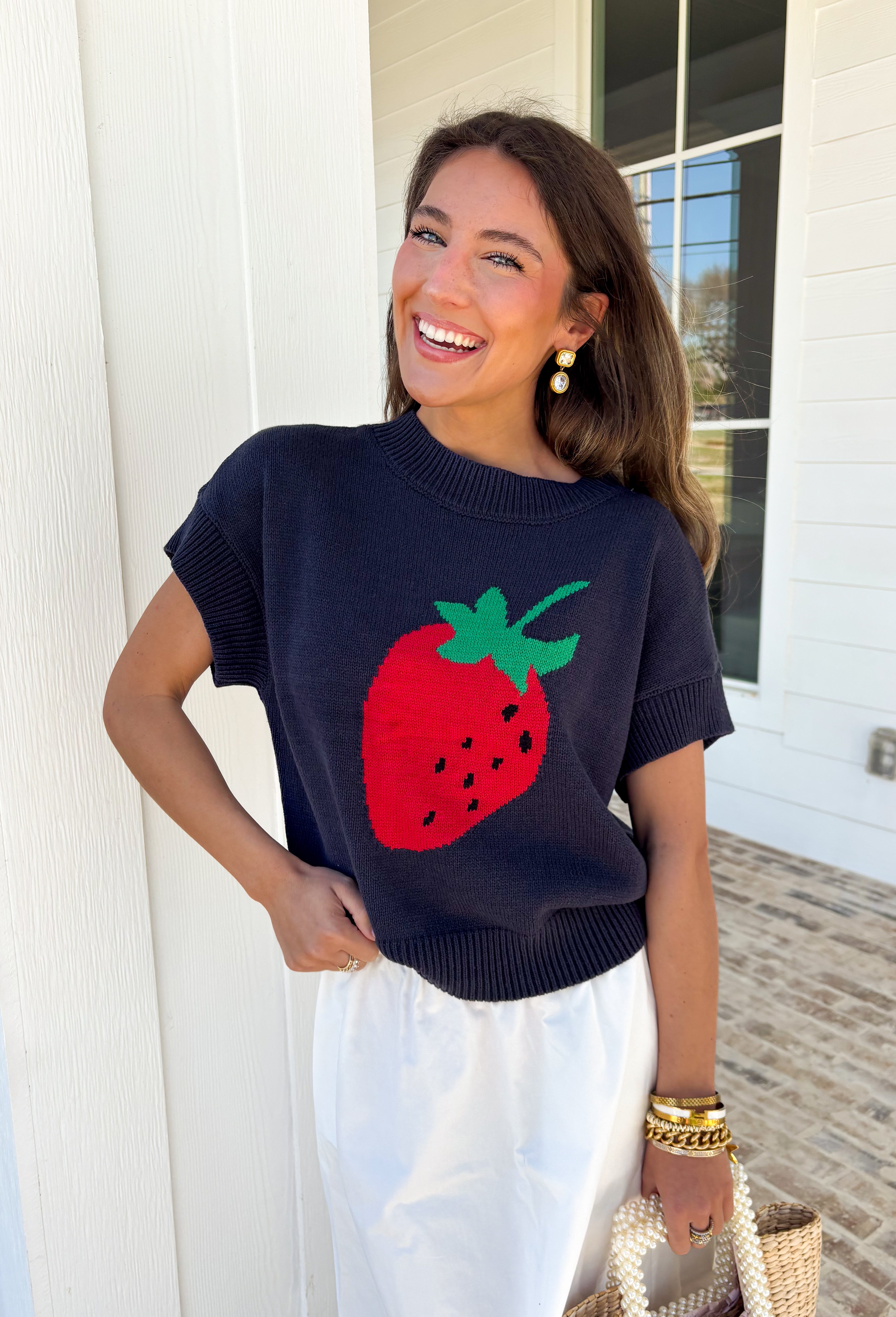 Sweet, playful, and full of charm! This navy short sleeve sweater features the cutest strawberry knit design that instantly adds a fun, fresh touch to your look. The rich navy background makes the strawberries pop, giving it that perfect mix of classic and playful style. Designed with a ribbed neckline, sleeves, and hem, this sweater offers a comfortable and flattering fit that’s easy to wear all day long. 