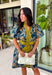 Bring timeless charm to your fall wardrobe with this beautifully detailed floral dress. Designed in a rich olive green with a stunning blue and navy floral print, this cotton dress is the perfect blend of classic and feminine. The flattering v-neckline, button-front design, and self-tie waist create a silhouette that's effortlessly polished, while the gathered back yoke adds a soft, flowy fit you'll love.