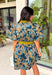 Bring timeless charm to your fall wardrobe with this beautifully detailed floral dress. Designed in a rich olive green with a stunning blue and navy floral print, this cotton dress is the perfect blend of classic and feminine. The flattering v-neckline, button-front design, and self-tie waist create a silhouette that's effortlessly polished, while the gathered back yoke adds a soft, flowy fit you'll love.