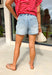 These light wash high waisted denim shorts are the definition of easy summer style! Designed with a relaxed mom short fit, they give you that effortlessly cool, lived-in look while still feeling flattering and comfortable. The extended button fly adds a vintage-inspired touch, and the elastic in the back gives you that extra bit of stretch where it matters most. Finished with a raw edge hem for a laid-back vibe, these are perfect for everything from beach days to running errands or casual lunch plans.