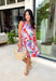 This pink floral midi dress is made for standing out in the best way this summer! Featuring a bold mix of tomato red, blue, green, purple, and white, it’s bright, fun, and full of personality. The sleeveless design keeps it cool and easy, while the tie detail at the back adds a subtle, feminine touch. Fully lined with side pockets (always a win), it’s as practical as it is eye-catching. Perfect for everything from brunch to vacation dinners, this is the kind of dress that does all the work for you. 