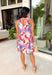 This pink floral midi dress is made for standing out in the best way this summer! Featuring a bold mix of tomato red, blue, green, purple, and white, it’s bright, fun, and full of personality. The sleeveless design keeps it cool and easy, while the tie detail at the back adds a subtle, feminine touch. Fully lined with side pockets (always a win), it’s as practical as it is eye-catching. Perfect for everything from brunch to vacation dinners, this is the kind of dress that does all the work for you. 
