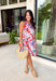 This pink floral midi dress is made for standing out in the best way this summer! Featuring a bold mix of tomato red, blue, green, purple, and white, it’s bright, fun, and full of personality. The sleeveless design keeps it cool and easy, while the tie detail at the back adds a subtle, feminine touch. Fully lined with side pockets (always a win), it’s as practical as it is eye-catching. Perfect for everything from brunch to vacation dinners, this is the kind of dress that does all the work for you. 