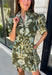 Welcome the season in effortless style with this charming floral dress! Featuring a rich olive backdrop with beautiful blue and soft green florals, this dress captures everything we love about fall. The ruffled high neckline and button front add timeless charm, while the self-tie waist in the back creates a flattering silhouette that's easy to customize. Finished with short puff sleeves, side pockets, and a fully lined design.
