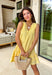 Soft, sunny, and full of charm! This butter yellow sleeveless dress features delicate swiss dot texture throughout for a light, airy feel that’s perfect for the season. The cheerful color instantly brightens your look while keeping things soft and feminine. Designed with a flattering v-neckline and subtle textured detailing along the neckline and hem, this dress adds just the right amount of interest while staying easy and timeless. 