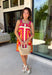 Bring on the sunshine in this vibrant floral dress! Designed with a neutral backdrop and a bold abstract floral print in shades of red, orange, pink, with pops of green and black, this dress is made to stand out all summer long. The pink rickrack trim along the front and hem adds a playful, vintage-inspired touch, while the adjustable straps and elastic back create a comfortable, flattering fit. 