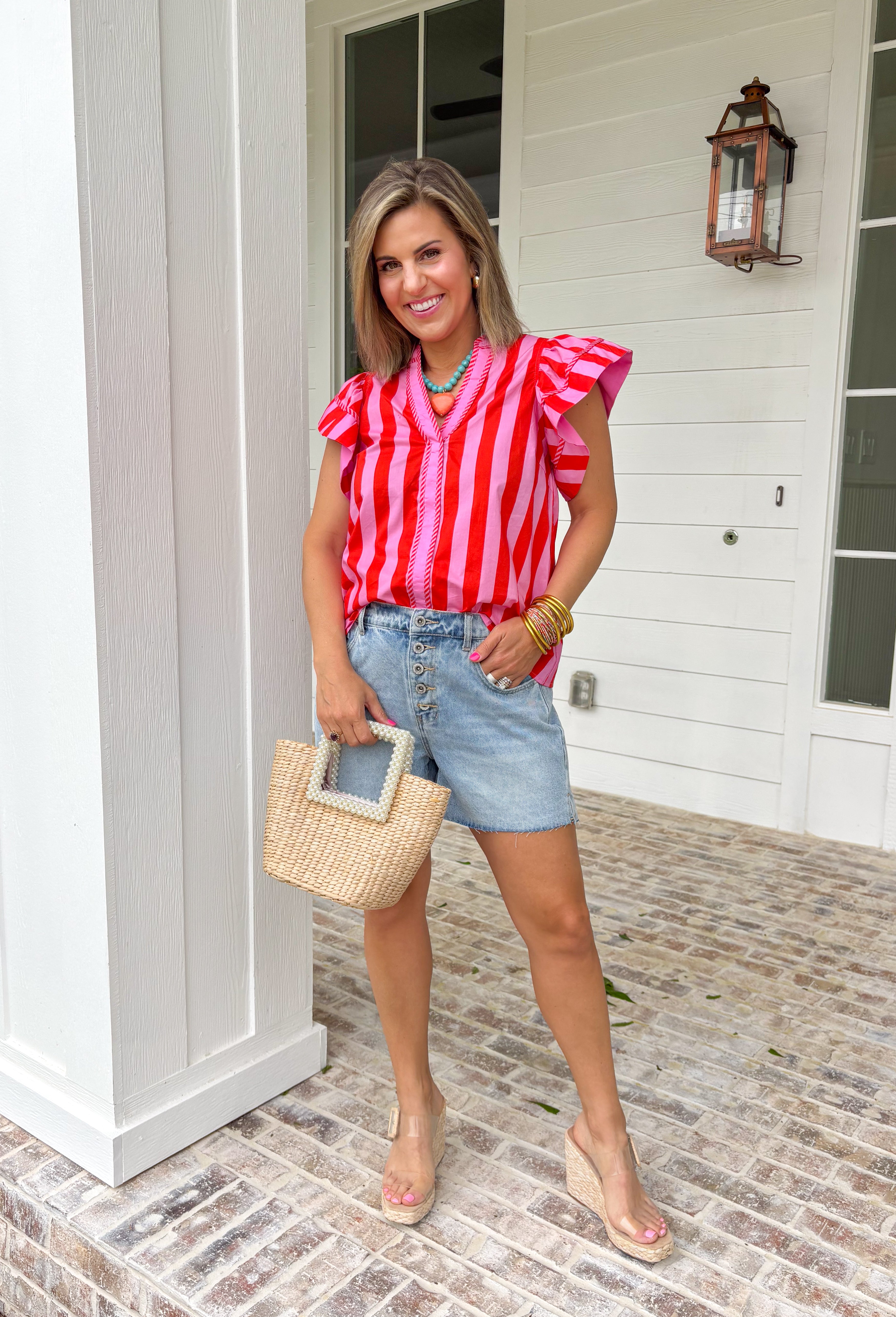 This pink and red striped flutter sleeve top is bringing all the bright, happy summer energy! The bold stripe combo feels fun and fresh, while the flutter sleeves add that soft, feminine touch that’s easy to dress up or down. The stripe trim along the v-neck gives it a unique, elevated detail that makes this one stand out from your everyday tops. Lightweight and breathable in 100% cotton, it’s perfect for warm days when you still want to feel put together.