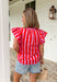 This pink and red striped flutter sleeve top is bringing all the bright, happy summer energy! The bold stripe combo feels fun and fresh, while the flutter sleeves add that soft, feminine touch that’s easy to dress up or down. The stripe trim along the v-neck gives it a unique, elevated detail that makes this one stand out from your everyday tops. Lightweight and breathable in 100% cotton, it’s perfect for warm days when you still want to feel put together.