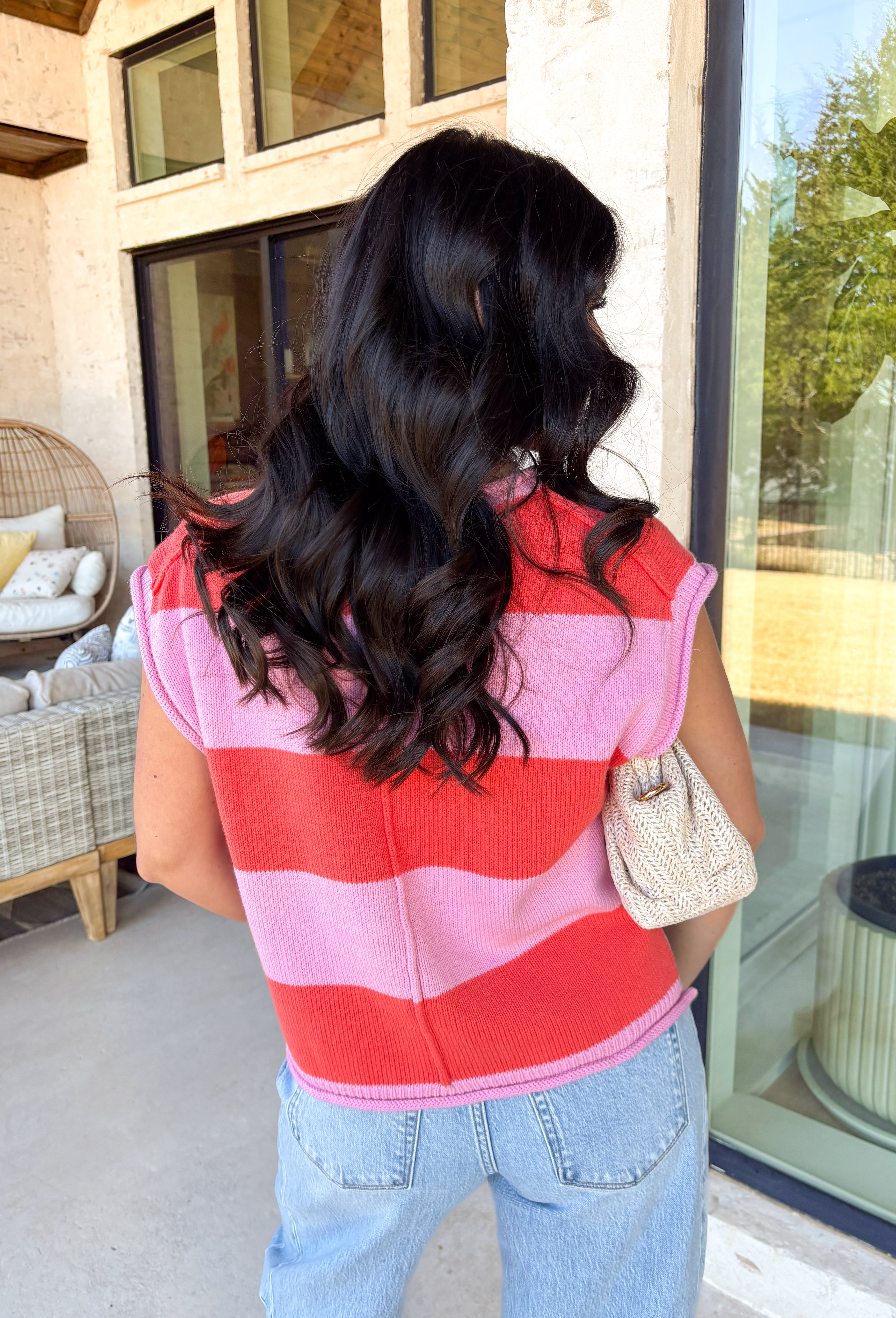 Say hello to your new warm-weather knit obsession! This coral and pink stripe sweater tank is lightweight, comfy, and just the right amount of cute for spring layering (or wearing solo when the sun finally shows up). The soft knit texture keeps it cozy without feeling heavy, and the playful stripes bring that happy, colorful vibe your closet’s been craving. 