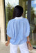 Easy, breezy, and perfect for spring, this blue and white striped short sleeve top by Entro is a go-to for effortless everyday style. The relaxed dolman sleeves give it a laid-back feel, while the contrast V-neck panel adds a clean, eye-catching detail that elevates the look. Lightweight with a soft drape, this top is comfortable, flattering, and made for pairing with your favorite denim or casual bottoms all season long.