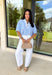 Easy, breezy, and perfect for spring, this blue and white striped short sleeve top by Entro is a go-to for effortless everyday style. The relaxed dolman sleeves give it a laid-back feel, while the contrast V-neck panel adds a clean, eye-catching detail that elevates the look. Lightweight with a soft drape, this top is comfortable, flattering, and made for pairing with your favorite denim or casual bottoms all season long.