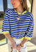 Bright, cheerful, and perfect for spring layering, this blue and off-white striped top by Entro adds a fun pop of color to a classic silhouette. Designed with 3/4 length sleeves, it features sunny yellow accents along the neckline, sleeve cuffs, and hem for a playful contrast that feels fresh and seasonal. Soft and lightweight, this top is easy to wear from casual days to weekend plans.