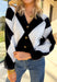 Classic with a cozy twist—this black and white argyle cardigan by On Twelfth is a timeless piece you’ll reach for again and again. The gold textured buttons add a touch of polish, while the soft knit fabric keeps it warm and comfortable for the season. Whether you dress it up or keep it casual, this cardigan brings effortless style to any outfit.