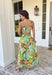 Vacation vibes in dress form! This green sleeveless midi dress features a vibrant tropical print in shades of green, tan, and blue with subtle pops of purple for the prettiest, eye-catching mix. It’s bold, breezy, and perfect for sunny days and warm nights. Designed with a flattering v-neckline and an open back for a little added wow factor, this dress also features smocked straps and a smocked back for a comfortable, flexible fit. Fully lined and lightweight.