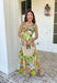 Vacation vibes in dress form! This green sleeveless midi dress features a vibrant tropical print in shades of green, tan, and blue with subtle pops of purple for the prettiest, eye-catching mix. It’s bold, breezy, and perfect for sunny days and warm nights. Designed with a flattering v-neckline and an open back for a little added wow factor, this dress also features smocked straps and a smocked back for a comfortable, flexible fit. Fully lined and lightweight.
