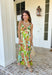 Vacation vibes in dress form! This green sleeveless midi dress features a vibrant tropical print in shades of green, tan, and blue with subtle pops of purple for the prettiest, eye-catching mix. It’s bold, breezy, and perfect for sunny days and warm nights. Designed with a flattering v-neckline and an open back for a little added wow factor, this dress also features smocked straps and a smocked back for a comfortable, flexible fit. Fully lined and lightweight.