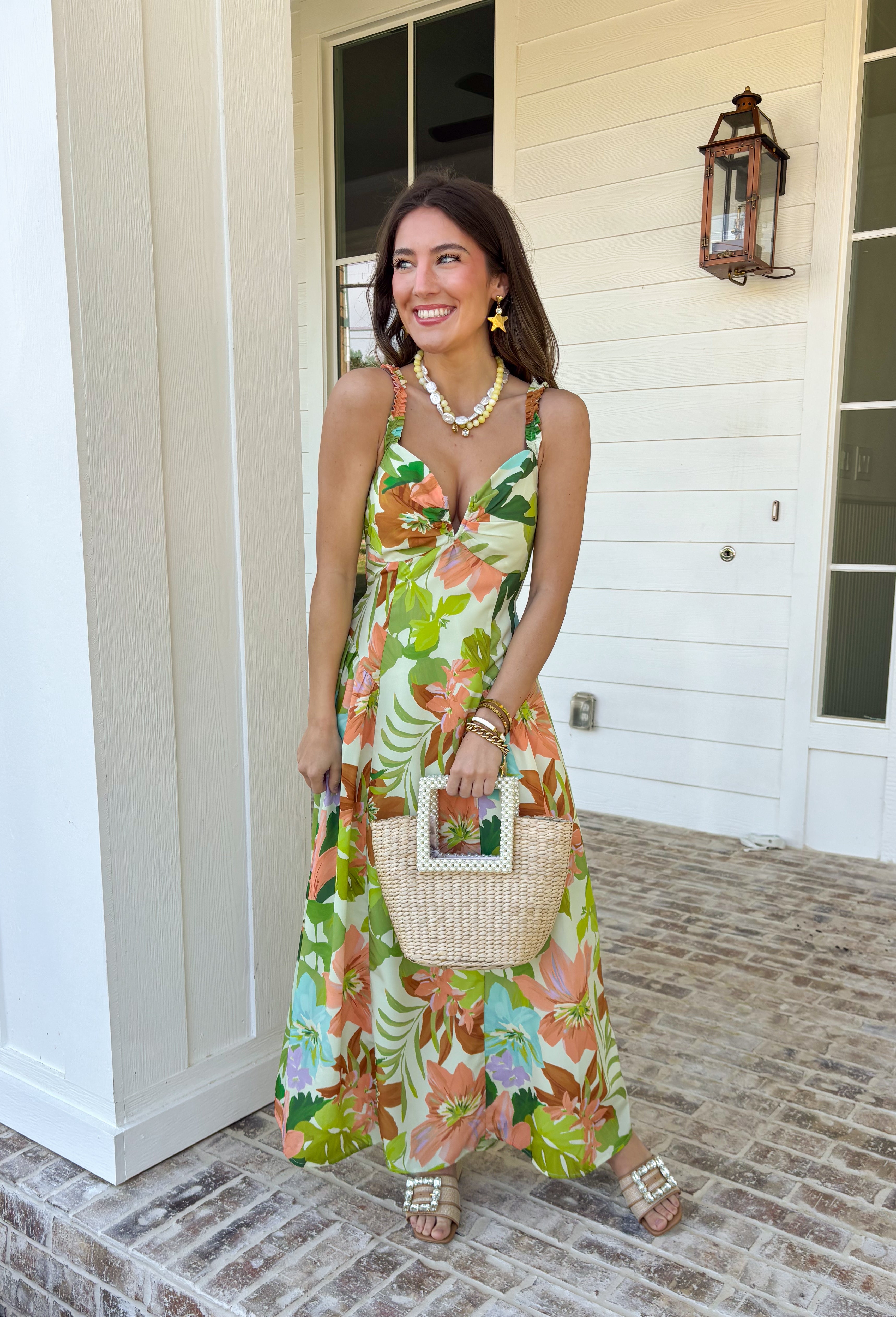 Vacation vibes in dress form! This green sleeveless midi dress features a vibrant tropical print in shades of green, tan, and blue with subtle pops of purple for the prettiest, eye-catching mix. It’s bold, breezy, and perfect for sunny days and warm nights. Designed with a flattering v-neckline and an open back for a little added wow factor, this dress also features smocked straps and a smocked back for a comfortable, flexible fit. Fully lined and lightweight.