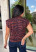 Bring a bold touch to your fall wardrobe with this effortlessly chic knit sweater. The camel and black zebra print offers a fresh take on animal print, while the mock neckline and sleeveless silhouette make it perfect for layering under jackets and cardigans or wearing on its own during those warm autumn afternoons. Soft, comfortable, and endlessly versatile, this is a piece you'll reach for again and again all season long.