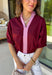 Rich fall colors and timeless details make this burgundy top an instant wardrobe favorite! The deep burgundy hue is beautifully accented with a pink trim along the neckline and front, creating a subtle pop of color that feels both feminine and sophisticated. The elastic puff sleeves add just the right amount of volume, giving this top an elevated look that's perfect for workdays, dinner dates, or weekend outings. Comfortable and easy to style, it's the kind of piece you'll reach for all season long.